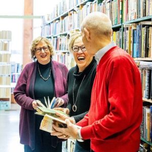 Retirees (left to right) Jan Roland, Beverly Vanderpool, and Dave Haist browse books at Reading Room Books in Wabash.