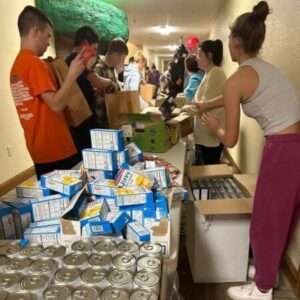 Wabash High School Students packing Thanksgiving Bags for Lighthouse Mission Thanksgiving Food Bags