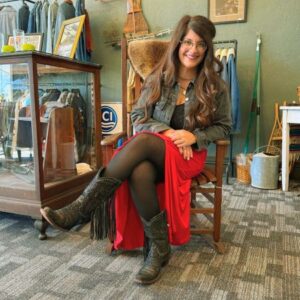 Photo of Jennifer sitting in a chair at Red Clover Shoppe