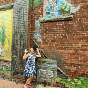 Christine Flohr posing like water is being poured on her