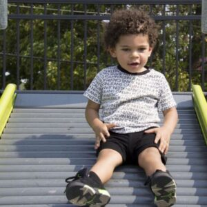 A kid going down the slide